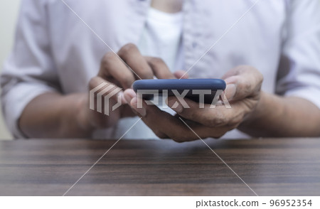 Hand man using smart phone mobile blurred background 96952354