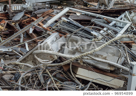Mixed waste piled up at a demolition site 96954899