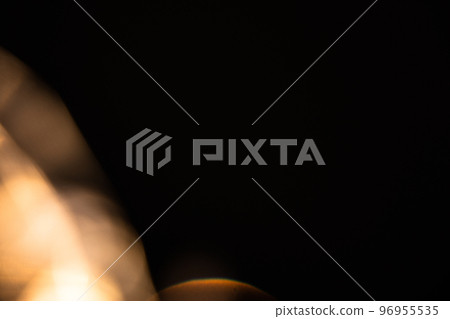 colorful golden crystal light leaks on black background 96955535