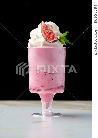 Mousse dessert with cream in glass on the table. 96956294