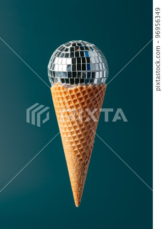 Christmas fun decorative fake ice cream cone on dark green background 96956349