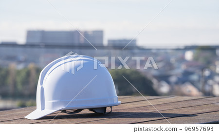 Helmet and cityscape | Construction industry / manufacturing industry image 96957693