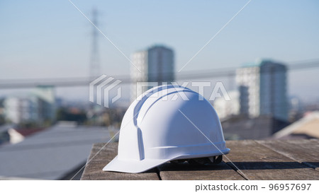 Helmet and cityscape | Construction industry / manufacturing industry image 96957697