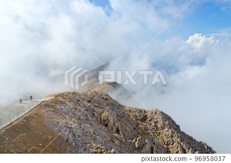 Observation deck on top of Mount Tahtali in clouds, Kemer neighborhood, Turkey 96958037