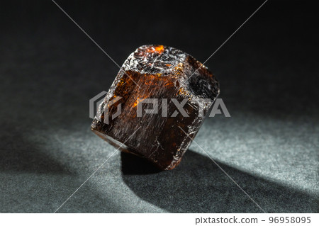 Brown Dravite Tourmaline Crystal Back Lit on Black Brown Dravite Tourmaline Crystal Back Lit on Black 96958095