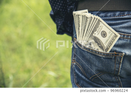 Hand holding money dollar bank note in wallet give financial payment. Man hands showing spread 100 dollar exchange cash payout. Saving Businessman counting money banknote bribe corruption concept. 96960224