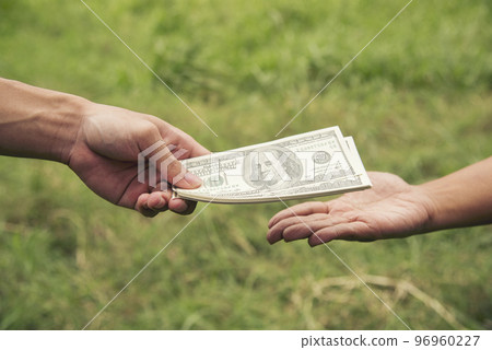 Close up hands giving money bribe payment. Hands holding dollar bill bribery financial economy business people. Business people corrupt illegal settlements try to pay graft. Corruption bribe concept 96960227