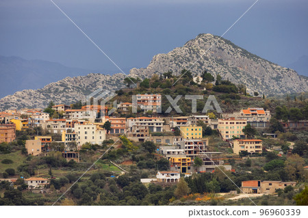 View of small touristic town in the mountains. Dorgali, Sardinia, Italy 96960339