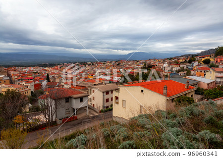 View of small touristic town in the mountains. Dorgali, Sardinia, Italy 96960341