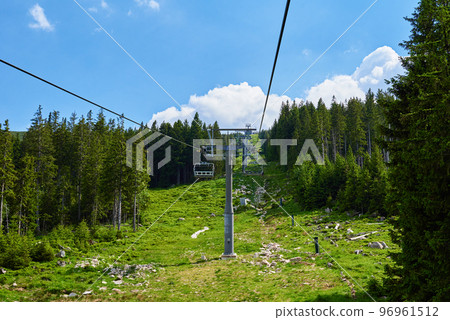 Open cable car line in mountains, Ski lify in resort for tourists Open cable car line in mountains, Ski lify in resort for tourists 96961512
