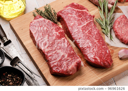 Prime marbled beef steaks. Raw striploin steak 96961626