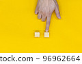 Hand pointing at an empty block for writing 96962664