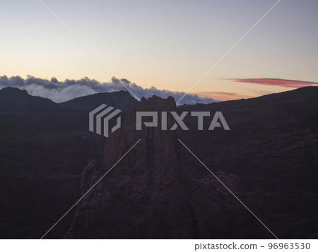 Red sunset light at Roques de Garcia with La Catedral volcanic rock formation at El Teide national park, Tenerife Canary islands, Spain. Red sunset light at Roques de Garcia with La Catedral volcanic rock formation at El Teide national park, Tenerife Canary islands, Spain. 96963530