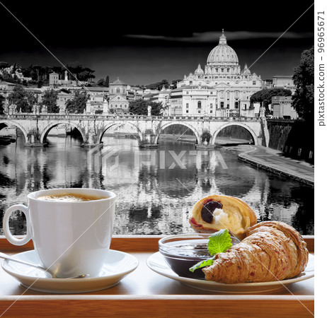 Saint Peter's Basilica and Tiber river against cup of fresh coffee with croissant in Rome, Italy 96965671
