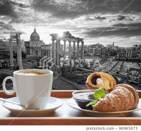 Roman Forum, also known as Forum of Caesar against cup of fresh coffee with croissant in Rome, Italy Roman Forum, also known as Forum of Caesar against cup of fresh coffee with croissant in Rome, Italy 96965673