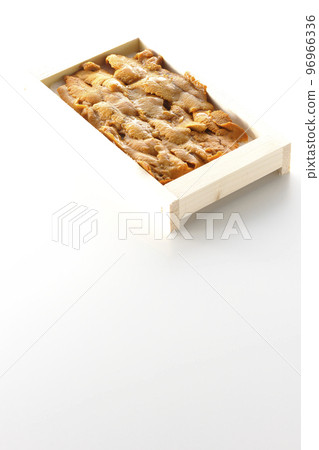 Sea urchin, a luxury ingredient in a wooden box, photographed against a white background Sea urchin, a luxury ingredient in a wooden box, photographed against a white background 96966336