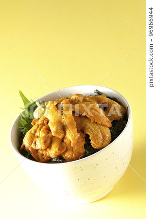 Fresh sea urchin rice bowl topped with perilla and wasabi Fresh sea urchin rice bowl topped with perilla and wasabi 96966944