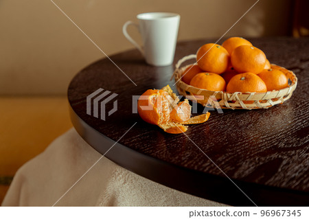 Mandarin orange on a kotatsu 96967345