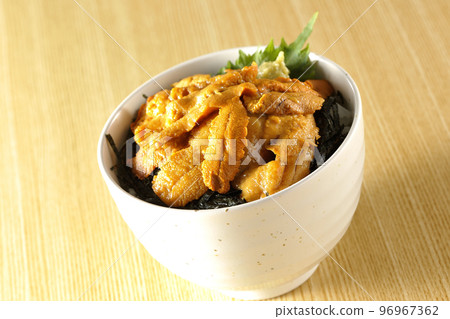 Fresh sea urchin rice bowl topped with perilla and wasabi 96967362