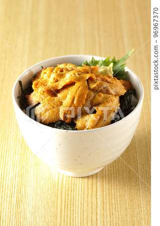 Fresh sea urchin rice bowl topped with perilla and wasabi Fresh sea urchin rice bowl topped with perilla and wasabi 96967370