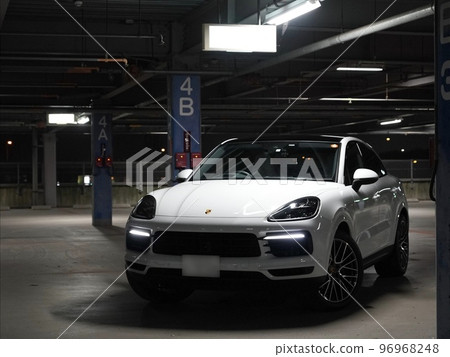 Front view of the Porsche Cayenne in a multi-storey car park at night 96968248