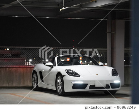 Porsche 718 Boxster in a multi-storey car park at night Porsche 718 Boxster in a multi-storey car park at night 96968249