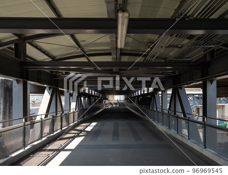 The lonely walkway of the metal frame bridge. The lonely walkway of the metal frame bridge. 96969545