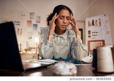 Designer, headache and woman stress in studio for creative burnout, management anxiety or fashion mistake. Black woman, frustrated and overworked fashion designer or tailor working on clothes design 96969988