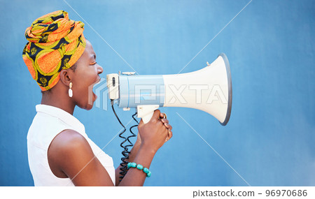 Black woman, megaphone and free space for freedom of speech, justice and equality on blue background for change, motivation and announcement. African female with microphone for protest or broadcast 96970686