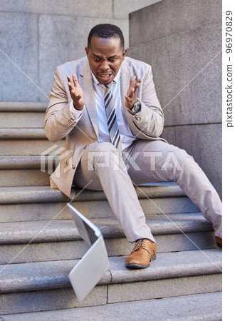 Businessman, laptop and mistake with damage, drop and fail while typing or reading email outdoor in the city. Black man, pc or technology with disaster, broken and accident crash on steps in New york 96970829