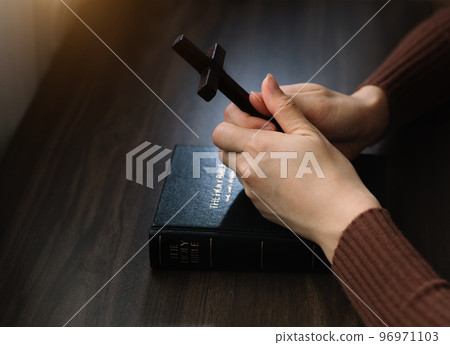 woman hands praying to god with the bible. Woman Pray for god blessing. Religious beliefs Christian life crisis prayer to god. 96971103