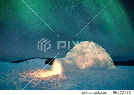 Wintry scene with glowing polar lights and snowy igloo Wintry scene with glowing polar lights and snowy igloo 96972728