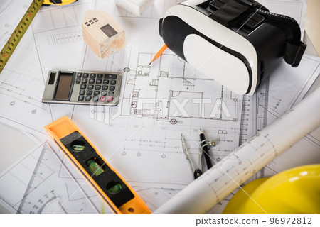 Architect workplace top view. Architectural blueprint paper project plans on desk table, tool for engineer contractor building design working drawing and VR glasses, industry virtual technology 96972812