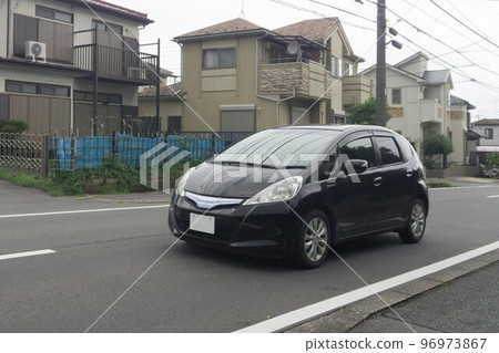 Compact car road driving 96973867