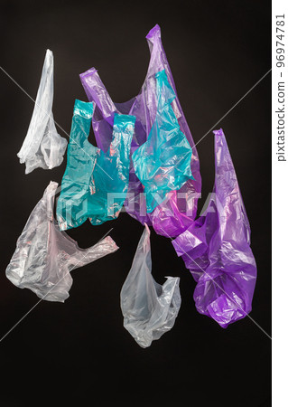 Vertical shot collection of colorful plastic bags. Isolated on black background. Vertical shot collection of colorful plastic bags. Isolated on black background. 96974781