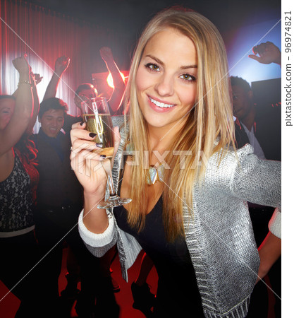 Night club, party and woman with champagne to celebrate, techno smile and social at a rave event. Rock disco, happy concert and portrait of a girl at a club new year celebration with a drink 96974821