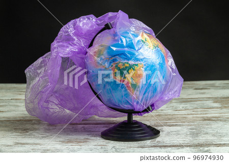 Earth globe covered with purple plastic bag. Concept enviroment pollution. 96974930