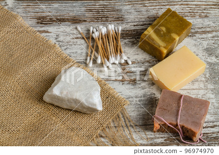 Ear sticks with craft soaps and salt rock. Spa and relax concept. 96974970