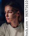 Portrait of a girl with kinesio tape on her face. Skin Care. Kinesio taping. Lifting tape on face 96975610