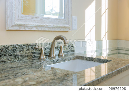 Master bathroom this house has been beautifully remodeled after renovation sink is made of marble Master bathroom this house has been beautifully remodeled after renovation sink is made of marble 96976208