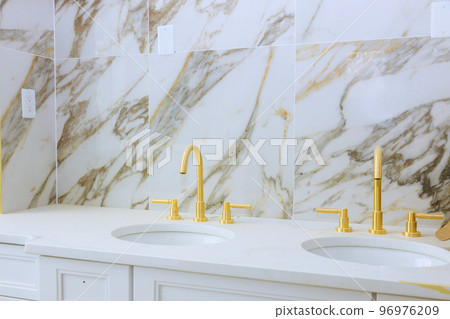 Beautifully remodeled master bathroom after renovation with marble sink Beautifully remodeled master bathroom after renovation with marble sink 96976209