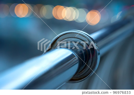 handrail railing made of stainless material close-up near the river embankment 96976833