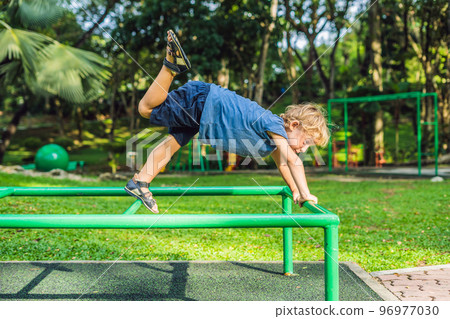 Portrait of child doing yoga in the park Portrait of child doing yoga in the park 96977030