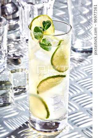 Caipirinha, Mojito cocktail, vodka or soda drink with lime, mint and straw on table 96977361