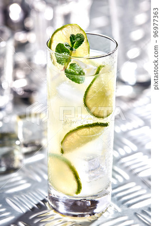 Caipirinha, Mojito cocktail, vodka or soda drink with lime, mint and straw on table 96977363