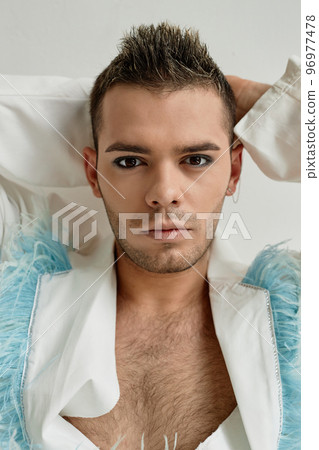 Close up portrait of non binary young man wearing makeup 96977478