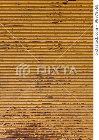 Old, yellow painted, rusted metal plate background. rustic top view background 96978069