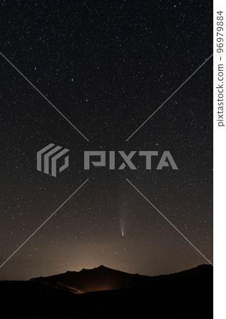 Neowise comet over the iconic mountain with pyramid shape 96979884