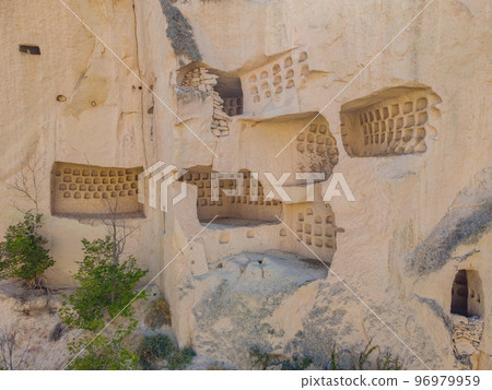 Beautiful stunning view of the mountains of Cappadocia and cave houses. Turkey Beautiful stunning view of the mountains of Cappadocia and cave houses. Turkey 96979959