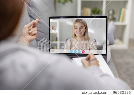 Pleasant talk using laptop Pleasant talk using laptop 96980156